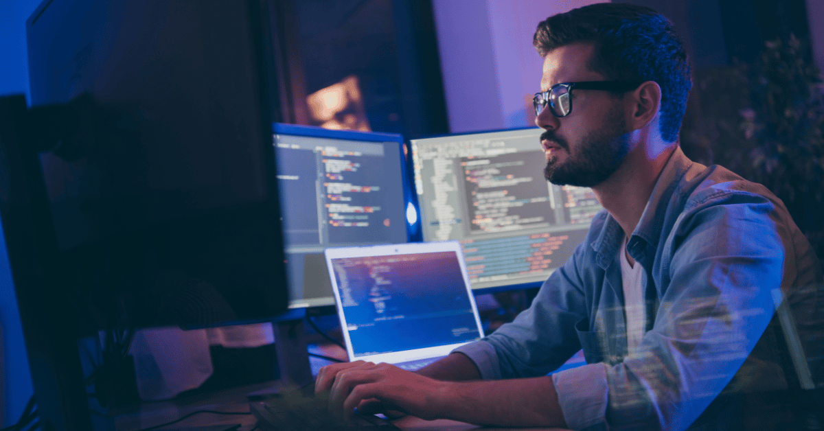 AI in IT Support: Analyst Examining Network Activity on Computer Screen